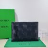 BOTTEGA VENETA Large Intreccio Leather Pouch.  High-End Quality Bag including gift box, care book, dust bag, authenticity card. This stylish zipped pouch from Bottega Veneta is a handy accessory to have. It is expertly crafted from a luxurious leather featuring the signature Intreccio weave. It features a removable wristlet so you can carry it however you desire. It also has a smooth leather interior lining which adds to its fine quality. It closes with a reliable metal zipper that runs across the top. Its multifunctional design makes it an essential addition to any wardrobe.