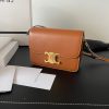 CELINE Teen Triomphe. High-End Quality Bag including gift box, care book, dust bag, authenticity card. In 2018, Hedi Slimane released the original Triomphe to much acclaim. Since then, the stylish purse has been spotted on the arms of celebrities and fashion insiders across the world. With its smooth leather exteriors and minimalistic hardware, the crossbody design reconciles fashion and function, featuring Celine's signature golden Triomphe logo fastener. It has attracted the attention of bag collectors and fashion historians alike for its sophisticated yet simple design. This classic piece has inspired a series of spinoffs, proving its timelessness and forever cementing the Triomphe as a fashion icon.