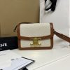 CELINE Teen Triomphe. High-End Quality Bag including gift box, care book, dust bag, authenticity card. In 2018, Hedi Slimane released the original Triomphe to much acclaim. Since then, the stylish purse has been spotted on the arms of celebrities and fashion insiders across the world. With its smooth leather exteriors and minimalistic hardware, the crossbody design reconciles fashion and function, featuring Celine's signature golden Triomphe logo fastener. It has attracted the attention of bag collectors and fashion historians alike for its sophisticated yet simple design. This classic piece has inspired a series of spinoffs, proving its timelessness and forever cementing the Triomphe as a fashion icon.
