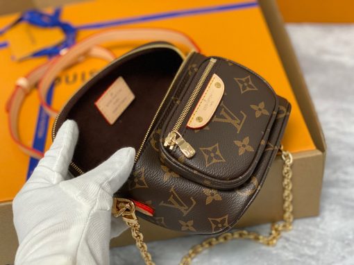 LOUIS VUITTON Mini Bumbag. High-End Quality Bag including gift box, care book, dust bag, authenticity card. Part of Louis Vuitton's Gradient Collection, the Mini Bumbag is an elegant take on the on-trend bag format. Crafted from Monogram Empreinte leather with a stunning printed gradation of colors, this bag will make a stylish addition to your accessory wardrobe. It features a zipped main compartment with a front pocket adorned with a Louis Vuitton leather tag as well as adjustable, removable straps that you can use for either cross-body or shoulder wear. This Mini Bumbag also comes with a stylish, gold-tone chain making it the perfect accessory for any summer occasion.