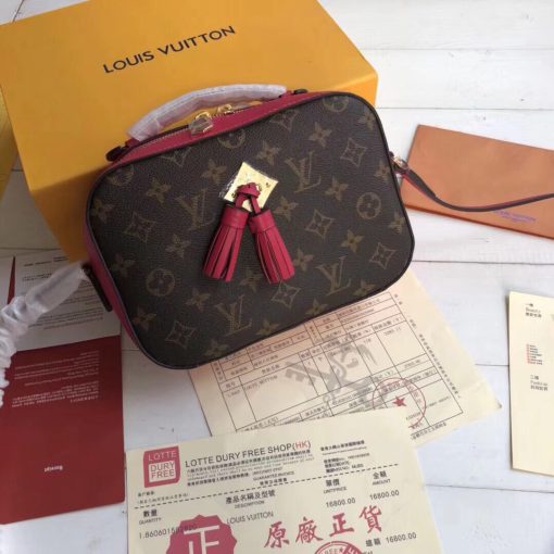 LOUIS VUITTON Saintonge Monogram Canvas Crossbody Bag. Original Quality Bag. Authentic calf leather trim and monogram coated canvas. Gold-toned Hardware. LOUIS VUITTON Sales Box and Dust Bag. Booklet, Authenticity Card, Payment Slip. Monogram canvas and smooth calfskin combine in the Saintonge, a compact bag with a youthful vibe. The leather lends contrast and volume to the design, and the tassels are a playful touch. With its top handle and long strap, the bag can be worn with top handle or as crossbody and shoulder bag.