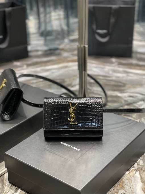 SAINT LAURENT Kate Belt Bag.  Original Quality Bag including gift box, care book, dust bag, authenticity card. Adjustable belt bag with a removable flap pouch and interlacing YSL initials. If you are a fan of an opulent touch, then you'll also be a fan of this logo-plaque belt bag from Saint Laurent. Carry your essentials in style.