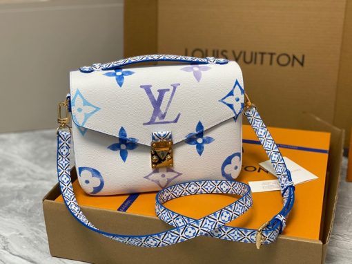 LOUIS VUITTON Pochette Métis MM. Style with a Portuguese Touch. This exquisite Pochette Metis handbag is crafted from cream-colored canvas and highlighted by pastel LV's and Monogram Flowers printed with a watercolor-like effect. The top handle and detachable strap present a more prominent Monogram Flower pattern, reminiscent of the Portuguese painted ceramic tilework.