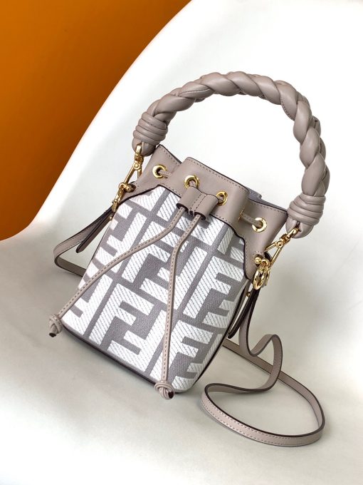 FENDI Mon Tresor Mini Bucket Bag: Style Meets Practicality This Mon Tresor Bag is a chic, minimalist dream. With its drawstring fastening and metal detailing on the sides and eyelets, this bag is as practical as a backpack and can be worn in different ways with its two detachable shoulder straps. It promises a spacious interior and supple leather construction to help store more than the average duffle bag or shoulder bag can manage. Despite it's thoughtfully practical design, it still looks luxurious and glamorous - no wonder it comes with a designer price tag!