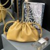 LOEWE Medium Flamenco Purse: Elegant Sophistication. Meet the Flamenco Purse – where timeless style meets modern elegance. Defined by its beautifully ruched design and signature side knots, this medium-sized bag is crafted from soft, supple nappa lambskin. It's the perfect blend of luxurious texture and sophisticated detailing, making it an essential accessory for any wardrobe.