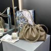 LOEWE Medium Flamenco Purse: Elegant Sophistication. Meet the Flamenco Purse – where timeless style meets modern elegance. Defined by its beautifully ruched design and signature side knots, this medium-sized bag is crafted from soft, supple nappa lambskin. It's the perfect blend of luxurious texture and sophisticated detailing, making it an essential accessory for any wardrobe.