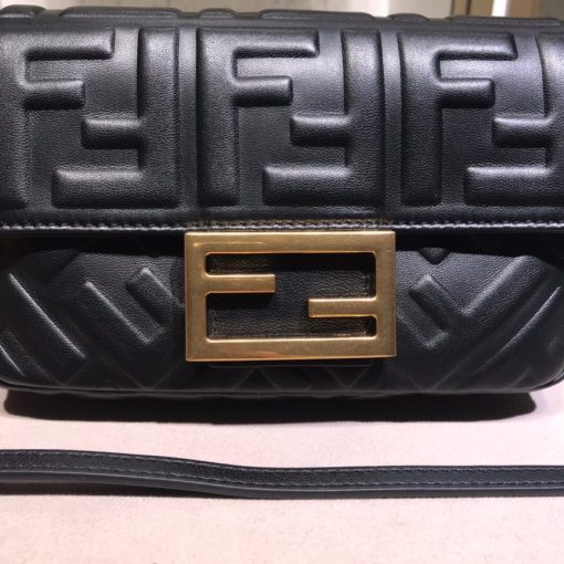 FENDI Baguette Mini. Original Quality Bag including gift box, literature, dust bag, authenticity card. The original It Bag is back. As the trend for everything the Nineties rolls on, it’s only right that Fendi’s iconic Baguette bag, which was created in 1997, has another turn in the spotlight. At the time, the Baguette quickly transcended any previous bag trends and became a phenomenon with women desperate to own as many designs as possible. There had never been such a fashionable yet high-end bag - yes, there were classics like Chanel’s 2.55 and Hermes’ Kelly and Birkin styles but the Baguette was new and fashion-led.