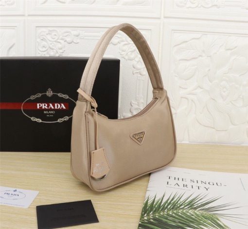 PRADA Re-Edition 2000 Nylon Mini Hobo. High-End Bag including gift box, dust bag, literature, and authenticity card. Practical and feminine, the nylon mini bag is decorated with iconic Saffiano leather trim. It features a contemporary mix of materials.