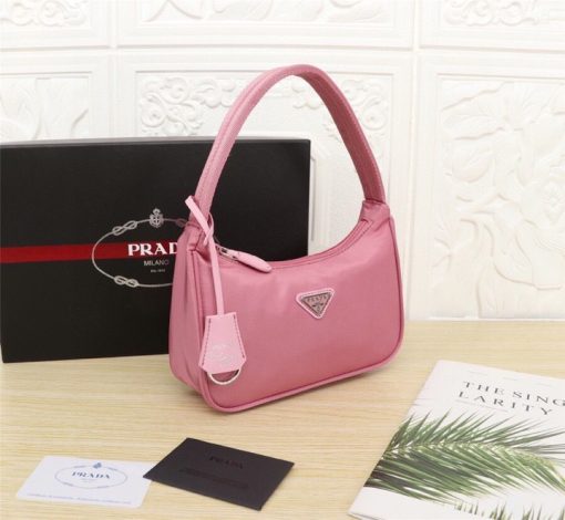 PRADA Re-Edition 2000 Nylon Mini Hobo. High-End Bag including gift box, dust bag, literature, and authenticity card. Practical and feminine, the nylon mini bag is decorated with iconic Saffiano leather trim. It features a contemporary mix of materials.