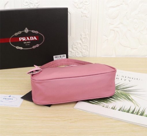 PRADA Re-Edition 2000 Nylon Mini Hobo. High-End Bag including gift box, dust bag, literature, and authenticity card. Practical and feminine, the nylon mini bag is decorated with iconic Saffiano leather trim. It features a contemporary mix of materials.