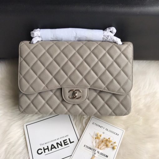 CHANEL 2.55 Classic Diamond Quilted Leather Double Flap Bag. Original Quality Bag. Authentic calfskin. Metal Toned Hardware. CHANEL Sales Box and Dust Bag. Booklet, Authenticity Card. The name 2.55 refers to the release of the bag in February 1955. It had a rectangular turn-lock which was called the Mademoiselle Lock. The 'CC' lock was introduced to the Classic Flap Bags only in the 1980s by designer Karl Lagerfeld. The all chain strap was replaced with the iconic leather interwoven chain link strap.