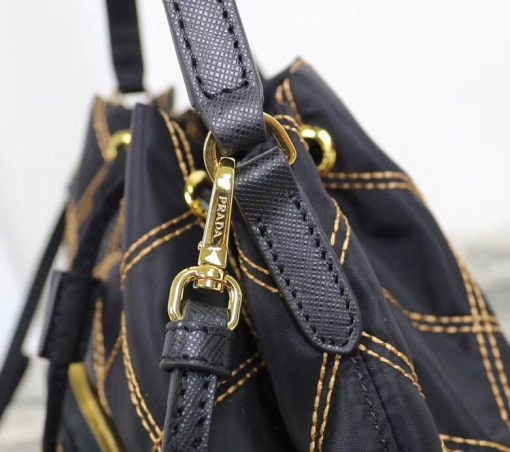 PRADA Quilted Bucket Bag. Original Quality Bag including gift box, care book, dust bag, authenticity card. PRADA nylon bucket bag with tessuto-impunturato quilted topstitching. Leather top handle. Drawstring top. Detachable Shoulder Strap. Front Zip Pocket with logo plate.