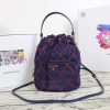 PRADA Quilted Bucket Bag. Original Quality Bag including gift box, care book, dust bag, authenticity card. PRADA nylon bucket bag with tessuto-impunturato quilted topstitching. Leather top handle. Drawstring top. Detachable Shoulder Strap. Front Zip Pocket with logo plate.