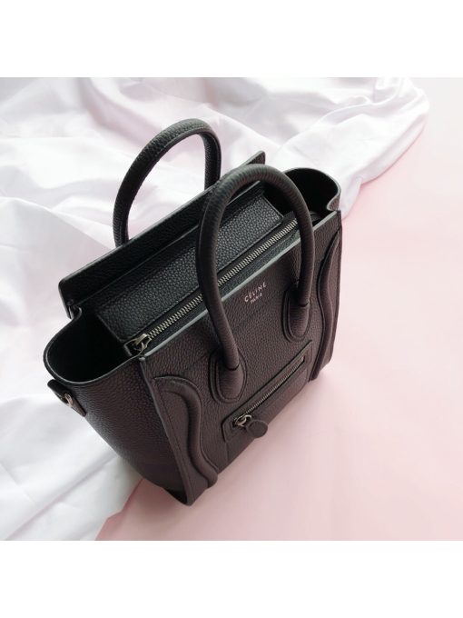 CELINE Luggage Nano. Original Quality Bag including gift box, care book, dust bag, authenticity card.  Nano luggage bag in calfskin with leather handles, a removable shoulder strap, and a zip closure. The bag has a zipped outer pocket on the front.