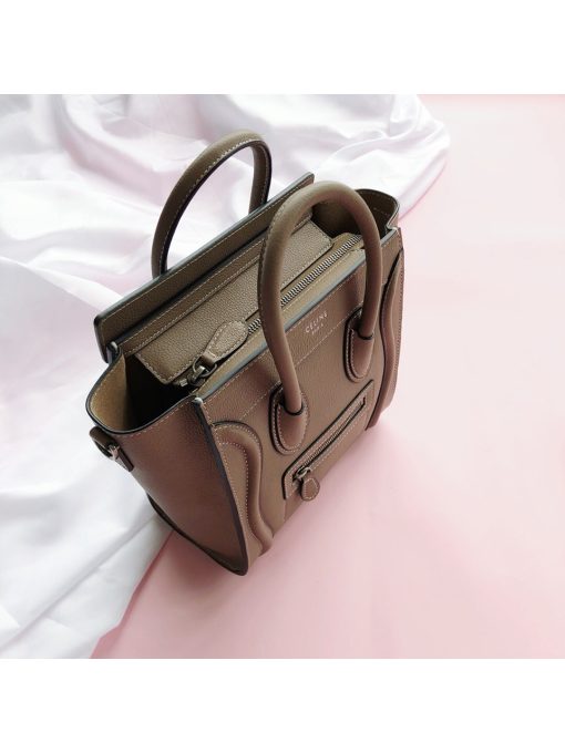 CELINE Luggage Nano. Original Quality Bag including gift box, care book, dust bag, authenticity card.  Nano luggage bag in calfskin with leather handles, a removable shoulder strap, and a zip closure. The bag has a zipped outer pocket on the front.