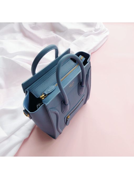 CELINE Luggage Nano. Original Quality Bag including gift box, care book, dust bag, authenticity card.  Nano luggage bag in calfskin with leather handles, a removable shoulder strap, and a zip closure. The bag has a zipped outer pocket on the front.