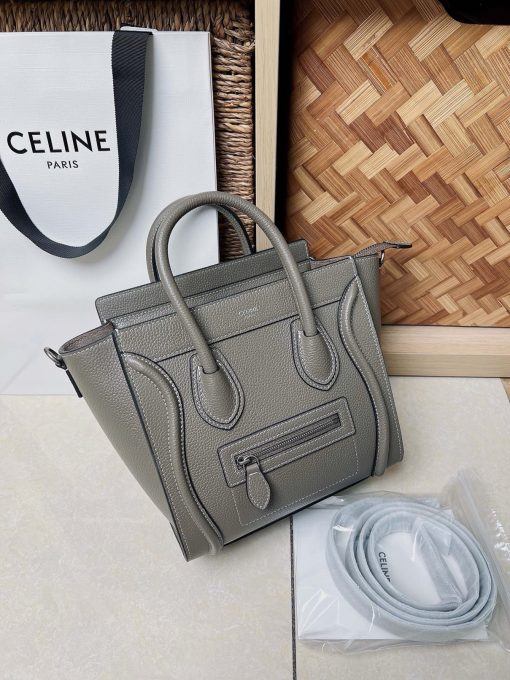 CELINE Luggage Nano. Original Quality Bag including gift box, care book, dust bag, authenticity card.  Nano luggage bag in calfskin with leather handles, a removable shoulder strap, and a zip closure. The bag has a zipped outer pocket on the front.