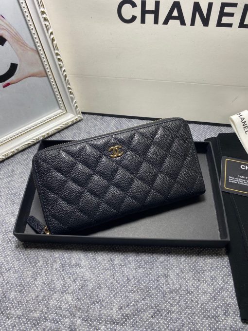 CHANEL Classic Long Zipped Wallet.  Original Quality Wallet including gift box, care book, dust bag, authenticity card. This wallet is one of the signature wallets of Chanel. It has been around for some time now and it will continue to stick around. This wallet is practical and amazing; perfect to hold paper money, credit cards and coins. The classic black color, you will get the signature burgundy colored interior. 