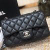 CHANEL Classic New Mini 20 cm Flap Bag. Original Quality Bag including gift box, care book, dust bag, authenticity card. This chic petite shoulder bag is crafted of luxurious shimmery lambskin leather. The crossbody bag features a long chain-link leather threaded shoulder strap and front flap with a CC turn lock. The flap opens to an interior of matching leather with zipper and patch pockets. Enjoy this fabulous bag for everyday essentials or special events with this timeless classic.