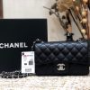 CHANEL Classic New Mini 20 cm Flap Bag. Original Quality Bag including gift box, care book, dust bag, authenticity card. This chic petite shoulder bag is crafted of luxurious shimmery lambskin leather. The crossbody bag features a long chain-link leather threaded shoulder strap and front flap with a CC turn lock. The flap opens to an interior of matching leather with zipper and patch pockets. Enjoy this fabulous bag for everyday essentials or special events with this timeless classic.