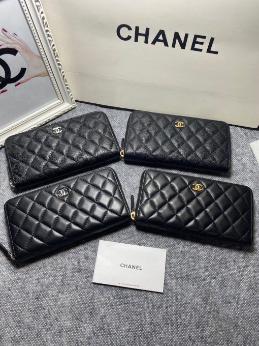 CHANEL Classic Long Zipped Wallet.  Original Quality Wallet including gift box, care book, dust bag, authenticity card. This wallet is one of the signature wallets of Chanel. It has been around for some time now and it will continue to stick around. This wallet is practical and amazing; perfect to hold paper money, credit cards and coins. The classic black color, you will get the signature burgundy colored interior. 