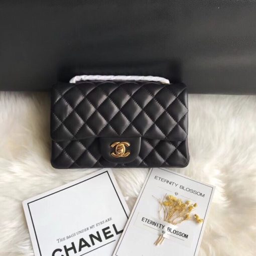 CHANEL Classic New Mini 20 cm Flap Bag. Original Quality Bag including gift box, care book, dust bag, authenticity card. This chic petite shoulder bag is crafted of luxurious shimmery lambskin leather. The crossbody bag features a long chain-link leather threaded shoulder strap and front flap with a CC turn lock. The flap opens to an interior of matching leather with zipper and patch pockets. Enjoy this fabulous bag for everyday essentials or special events with this timeless classic.