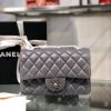 CHANEL Classic New Mini 20 cm Flap Bag. Original Quality Bag including gift box, care book, dust bag, authenticity card. This chic petite shoulder bag is crafted of luxurious shimmery lambskin leather. The crossbody bag features a long chain-link leather threaded shoulder strap and front flap with a CC turn lock. The flap opens to an interior of matching leather with zipper and patch pockets. Enjoy this fabulous bag for everyday essentials or special events with this timeless classic.