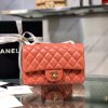 CHANEL Classic New Mini 20 cm Flap Bag. Original Quality Bag including gift box, care book, dust bag, authenticity card. This chic petite shoulder bag is crafted of luxurious shimmery lambskin leather. The crossbody bag features a long chain-link leather threaded shoulder strap and front flap with a CC turn lock. The flap opens to an interior of matching leather with zipper and patch pockets. Enjoy this fabulous bag for everyday essentials or special events with this timeless classic.