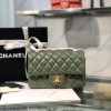 CHANEL Classic New Mini 20 cm Flap Bag. Original Quality Bag including gift box, care book, dust bag, authenticity card. This chic petite shoulder bag is crafted of luxurious shimmery lambskin leather. The crossbody bag features a long chain-link leather threaded shoulder strap and front flap with a CC turn lock. The flap opens to an interior of matching leather with zipper and patch pockets. Enjoy this fabulous bag for everyday essentials or special events with this timeless classic.