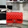 CHANEL Classic New Mini 20 cm Flap Bag. Original Quality Bag including gift box, care book, dust bag, authenticity card. This chic petite shoulder bag is crafted of luxurious shimmery lambskin leather. The crossbody bag features a long chain-link leather threaded shoulder strap and front flap with a CC turn lock. The flap opens to an interior of matching leather with zipper and patch pockets. Enjoy this fabulous bag for everyday essentials or special events with this timeless classic.