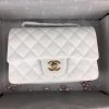 CHANEL Classic New Mini 20 cm Flap Bag. Original Quality Bag including gift box, care book, dust bag, authenticity card. This chic petite shoulder bag is crafted of luxurious shimmery lambskin leather. The crossbody bag features a long chain-link leather threaded shoulder strap and front flap with a CC turn lock. The flap opens to an interior of matching leather with zipper and patch pockets. Enjoy this fabulous bag for everyday essentials or special events with this timeless classic.