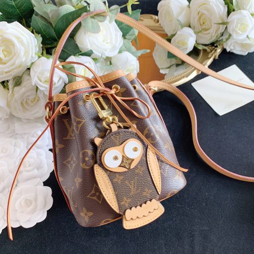 LOUIS VUITTON Owl Bag-Charm & Key Holder. Original Quality Charm including gift box, care book, dust bag, authenticity card. The mascot on the Owl bag charm and key holder is brought to life with LV studs for eyes and a Monogram Flower beak. Gold-color hardware joins calf leather and Monogram Eclipse canvas in a playful mingling of the House's signature materials. The hook and ring on this are both engraved with the Louis Vuitton signature for an elegant finish.