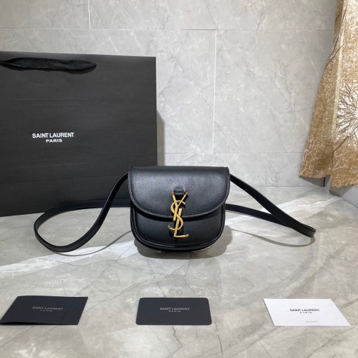 SAINT LAURENT Kaia YSL-Plaque Leather Cross-Body Bag. Original Quality Bag including gift box, care book, dust bag, authenticity card. SAINT LAURENT'S Kaia bag features the label's signature YSL plaque which was sketched by the graphic designer A.M. Cassandre, one of the 20th century's most prominent poster artists. It's crafted from leather to a curved silhouette that's reminiscent of a saddle, then accented by white topstitching. Carry it by the adjustable shoulder strap for contemporary polish.