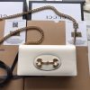 GUCCI 1955 GG Supreme Horsebit Wallet On Chain. Original Quality Wallet including gift box, care book, dust bag, authenticity card. This chain wallet in GG Supreme canvas and leather is introduced as part of the Gucci Horsebit 1955 accessories collection, defined by the double ring and bar design also found in Handbags. The folded snap-closure shape features several card slots and pockets, completed with a detachable chain strap.