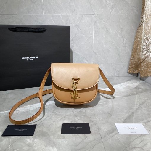 SAINT LAURENT Kaia YSL-Plaque Leather Cross-Body Bag. Original Quality Bag including gift box, care book, dust bag, authenticity card. SAINT LAURENT'S Kaia bag features the label's signature YSL plaque which was sketched by the graphic designer A.M. Cassandre, one of the 20th century's most prominent poster artists. It's crafted from leather to a curved silhouette that's reminiscent of a saddle, then accented by white topstitching. Carry it by the adjustable shoulder strap for contemporary polish.