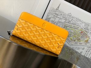 GOYARD Matignon GM Wallet: A Statement of Elegance and Functionality. Experience luxury and functionality with the Goyard Matignon GM Wallet. Crafted from premium calf leather and Goyardine canvas, it offers twelve card slots, a zipper pocket, and two spacious compartments, all secured by a snap button closure. Handcrafted by skilled artisans, Whether you're running errands or gracing a formal occasion, this wallet is the ultimate style companion. Choose from an array of colors to reflect your personality and elevate your ensemble. With this wallet, you'll not only radiate elegance but also experience unparalleled functionality.