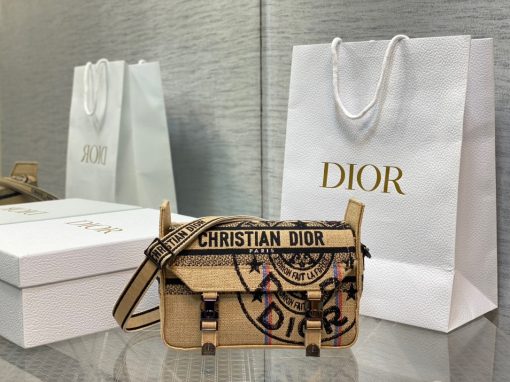 DIOR Small DiorCamp Bag. Original Quality Bag including gift box, care book, dust bag, authenticity card. Maria Grazia Chiuri has updated the classic messenger bag by adding signature Dior details for a relaxed and modern look. Fully embroidered with the Dior Oblique motif, the bag is enhanced by a 'CHRISTIAN DIOR PARIS' signature flap, as well as sportswear-inspired 'CD' buckles. Equipped with an adjustable and removable shoulder strap, the small, compact messenger bag can be worn over the shoulder or crossbody, and will make an ideal urban companion.