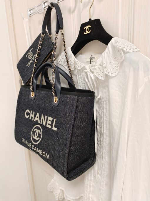 CHANEL Maxi Small Shopping Bag. Original Quality Bag including gift box, care book, dust bag, authenticity card. Luxuriously stylish and chic, this Chanel bag can carry all your essentials and other shopping items. This one is attention grabbing due to its large size and uniquely fun style. The logo comes in white lettering, proudly displaying that it’s a Chanel bag. The interwoven chained shoulder straps and the handles are two practical things you shouldn’t dare miss. Yes, it means you can carry it by the hand or over the shoulder. And just like your high-fashion denim jeans, this new oversized bag is made from denim, which means its durable, strong and easy to maintain.