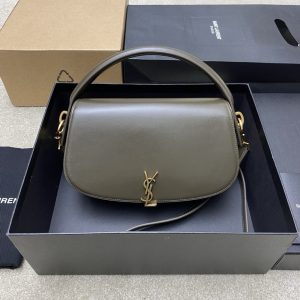 SAINT LAURENT Voltaire in Box with a Twist of Modernity: Iconic Elegance. Introducing the Half-Moon Shoulder Bag – a seamless blend of elegance and modernity. Crafted in luxurious calfskin with a subtle polished finish, this chic accessory features a distinctive flap with the iconic pivoting CASSANDRE closure. Complete with an adjustable and detachable swivel-hook strap, it offers versatile carry options to suit any style. Elevate your look with this timeless masterpiece.