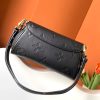 LOUIS VUITTON Favorite: Effortlessly Chic, Versatile Style. Meet The Favorite—a stunning blend of elegance and versatility. Crafted from soft, grained leather adorned with a bold oversized embossed Monogram pattern, this bag is the epitome of chic style. Feminine pleats add a couture-inspired touch, while the gold-tone magnetic lock pays homage to the Maison's storied heritage. With its removable and adjustable strap, The Favorite offers multiple ways to wear: short-shoulder or cross-body for day, and a detachable gold-tone chain for a glamorous evening look. Effortlessly stylish and endlessly adaptable, The Favorite is the perfect accessory for every occasion.