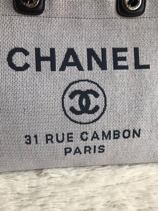 CHANEL Large Deauville Shopping Bag 2021. Authentic quality bag including gift box, booklet, dust bag, authenticity card. The CHANEL Deauville tote matured to a signature CHANEL bag. The bestseller Deauville often appears in seasonal launches in unexpected colors and materials. On the CHANEL website, Chanel calls it the Shopping Bag, but if you walk into a CHANEL boutique and ask for the Deauville, you will be directed to this tote bag.