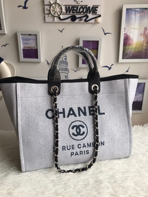 CHANEL Large Deauville Shopping Bag 2021. Authentic quality bag including gift box, booklet, dust bag, authenticity card. The CHANEL Deauville tote matured to a signature CHANEL bag. The bestseller Deauville often appears in seasonal launches in unexpected colors and materials. On the CHANEL website, Chanel calls it the Shopping Bag, but if you walk into a CHANEL boutique and ask for the Deauville, you will be directed to this tote bag.