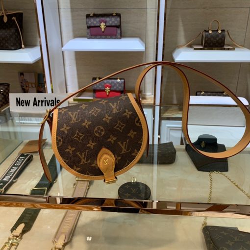 LOUIS VUITTON Tambourin Monogram Crossbody Bag. Original Quality Bag including gift box, care book, dust bag, authenticity card. Nicolas Ghesquière introduces a new version of the versatile and easy-to-wear LOUIS VUITTON Tambourin Monogram Crossbody Bag, made from Monogram canvas and natural cowhide leather. Small and lightweight with a practical inside pocket, this functional bag is ideal for everyday use. It can be worn over the shoulder or cross-body.