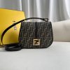 FENDI C’mon Medium. Timeless Elegance, Embodied in Leather. Elegantly designed, this medium-sized satchel bag boasts graceful, curved lines that exude femininity. Its elongated flap is adorned with a striking metal FF logo, adding a touch of sophistication to its overall charm. Crafted from supple leather with meticulously embossed edges and intricate details, this bag radiates a sense of refined luxury. The sides of the bag seamlessly blend with the overall design, crafted from the same tone-on-tone full-grain leather, ensuring a harmonious and visually pleasing aesthetic.