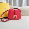 FENDI C’mon Mini. Embrace Elegance: Stefano Pilati's Curvaceous Creation. A petite satchel bag, graced with graceful, feminine curves, represents a masterpiece from the illustrious collection envisioned by the renowned Stefano Pilati. Fashioned from sumptuously smooth leather, this exquisite piece is adorned with meticulously embossed accents and edges, culminating in a striking FF logo proudly showcased on its elegant flap.