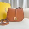 FENDI C’mon Medium. Timeless Elegance, Embodied in Leather. Elegantly designed, this medium-sized satchel bag boasts graceful, curved lines that exude femininity. Its elongated flap is adorned with a striking metal FF logo, adding a touch of sophistication to its overall charm. Crafted from supple leather with meticulously embossed edges and intricate details, this bag radiates a sense of refined luxury. The sides of the bag seamlessly blend with the overall design, crafted from the same tone-on-tone full-grain leather, ensuring a harmonious and visually pleasing aesthetic.