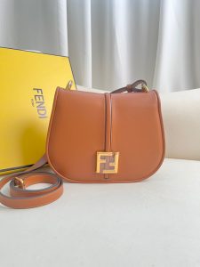 FENDI C’mon Medium. Timeless Elegance, Embodied in Leather. Elegantly designed, this medium-sized satchel bag boasts graceful, curved lines that exude femininity. Its elongated flap is adorned with a striking metal FF logo, adding a touch of sophistication to its overall charm. Crafted from supple leather with meticulously embossed edges and intricate details, this bag radiates a sense of refined luxury. The sides of the bag seamlessly blend with the overall design, crafted from the same tone-on-tone full-grain leather, ensuring a harmonious and visually pleasing aesthetic.