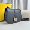FENDI C’mon Medium. Timeless Elegance, Embodied in Leather. Elegantly designed, this medium-sized satchel bag boasts graceful, curved lines that exude femininity. Its elongated flap is adorned with a striking metal FF logo, adding a touch of sophistication to its overall charm. Crafted from supple leather with meticulously embossed edges and intricate details, this bag radiates a sense of refined luxury. The sides of the bag seamlessly blend with the overall design, crafted from the same tone-on-tone full-grain leather, ensuring a harmonious and visually pleasing aesthetic.