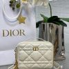DIOR Caro Box Bag With Chain. Original Quality Bag including gift box, care book, dust bag, authenticity card. Maria Grazia Chiuri's Dior Caro box bag with chain is a modern creation. Crafted in calfskin, it stands out with a unique Macrocannage quilted effect and a spacious compartment, including three card slots, to accommodate all the daily essentials. The removable chain strap features a leather insert for comfortable and adjustable wear, either over the shoulder or crossbody, while the handle allows it to be carried by hand.