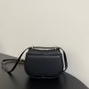 FENDI C’mon Mini. Embrace Elegance: Stefano Pilati's Curvaceous Creation. A petite satchel bag, graced with graceful, feminine curves, represents a masterpiece from the illustrious collection envisioned by the renowned Stefano Pilati. Fashioned from sumptuously smooth leather, this exquisite piece is adorned with meticulously embossed accents and edges, culminating in a striking FF logo proudly showcased on its elegant flap.